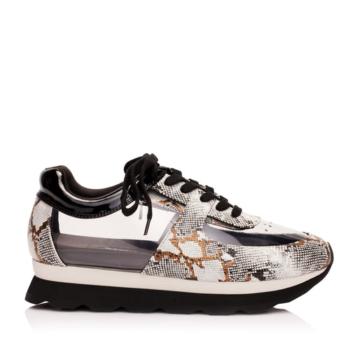 Profile of the glass snakeskin sneakers from luxury women’s shoe brand Jessica Rich.
