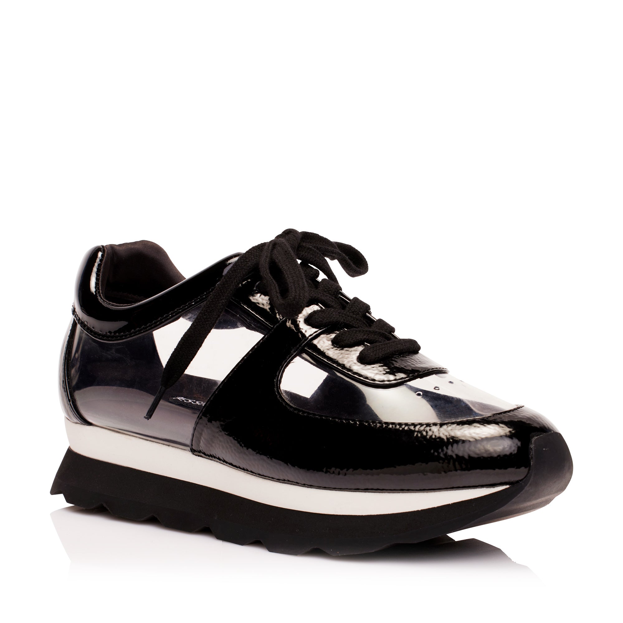 View of the glass sneakers from luxury women’s shoe brand Jessica Rich from an angle.