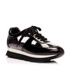 View of the glass sneakers from luxury women’s shoe brand Jessica Rich from an angle.